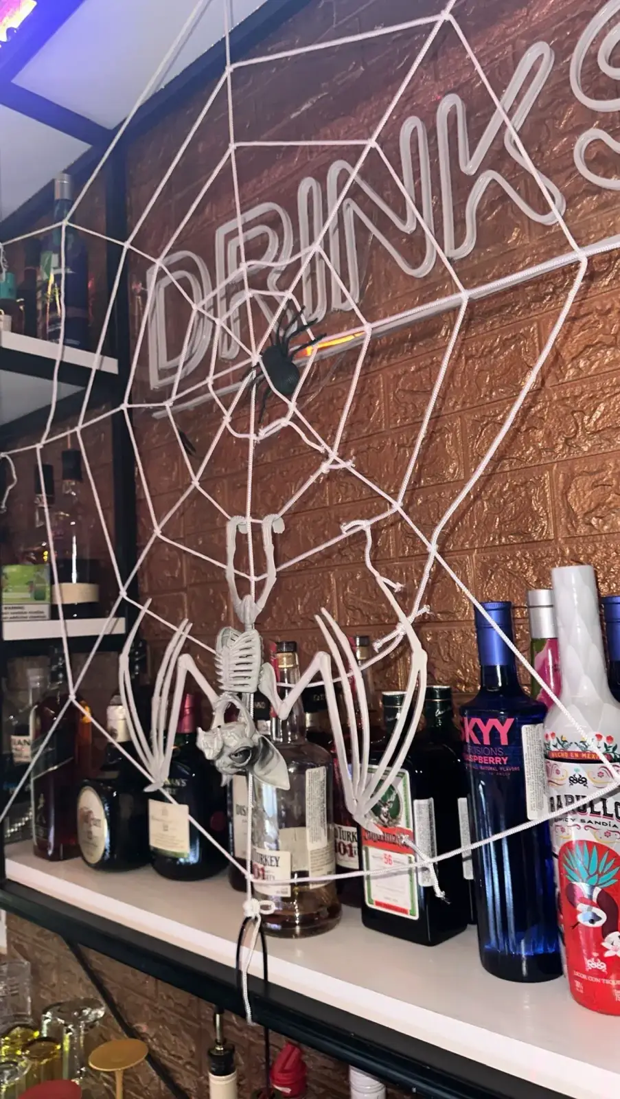 Bar decorated with spider webs for Halloween
